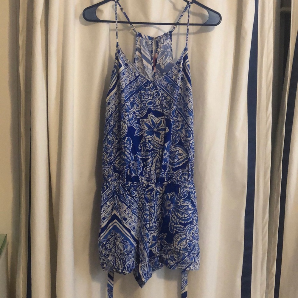 Fun blue patterned romper with adjustable straps